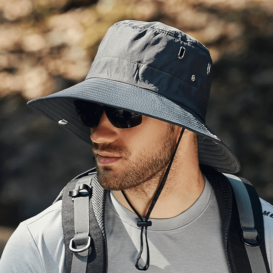 Lightweight beige bucket hat with UPF50+ protection, perfect for outdoor activities and casual wear. 2