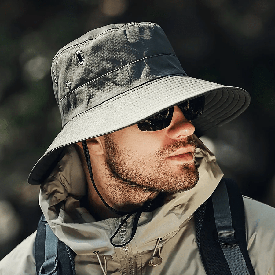 Lightweight beige bucket hat with UPF50+ protection, perfect for outdoor activities and casual wear. 4