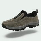 Men's laceless slip-on walking shoes with a chunky lugged grip sole.