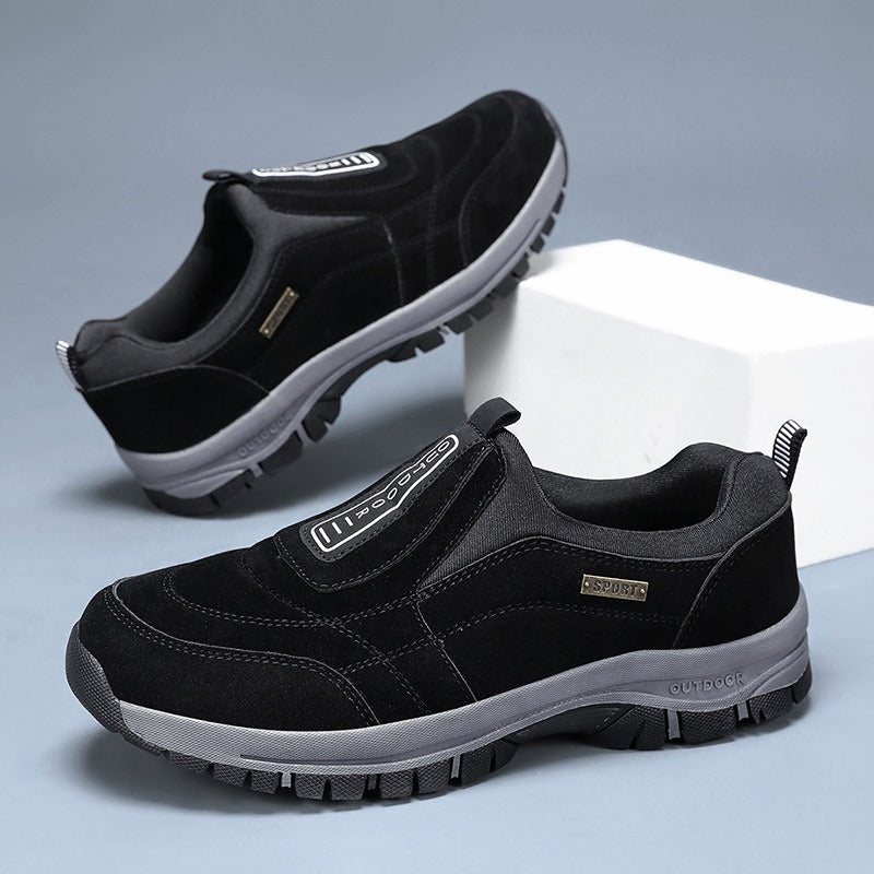 Men's laceless slip-on walking shoes with a chunky lugged grip sole.