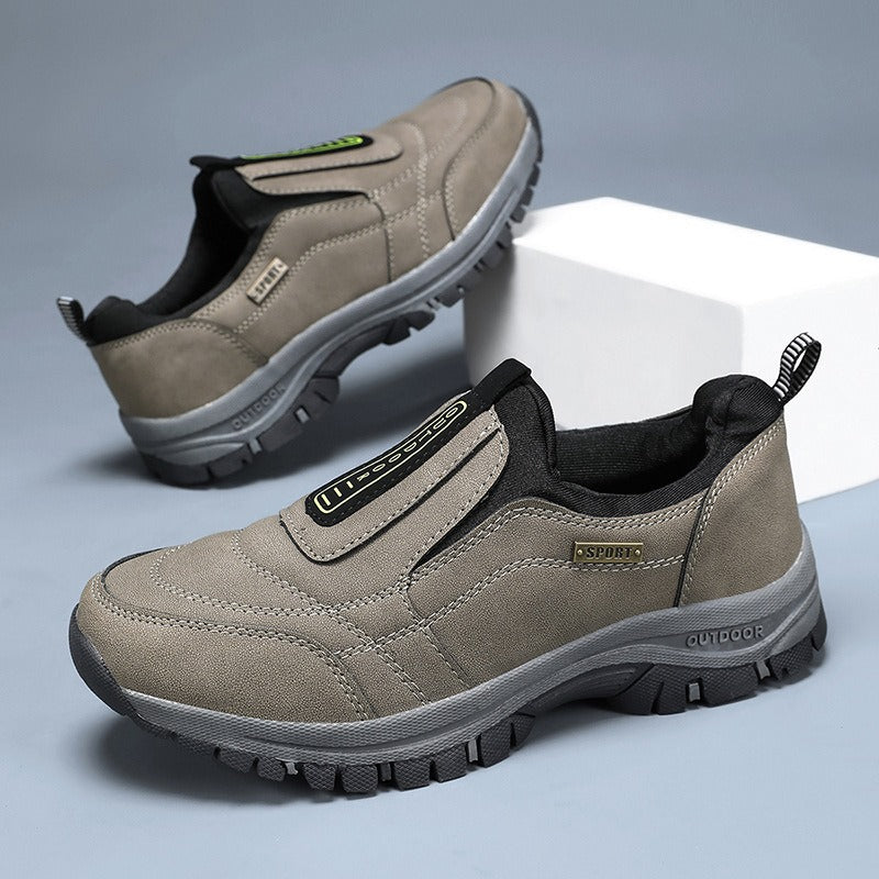 Men's laceless slip-on walking shoes with a chunky lugged grip sole.