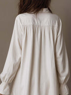 A lavender long-sleeve dress with a retro lace design and an irregular hem. 1