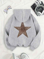 Light grey oversized women's hoodie with a large leopard-print star on the back.