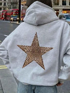 Light grey oversized women's hoodie with a large leopard-print star on the back.