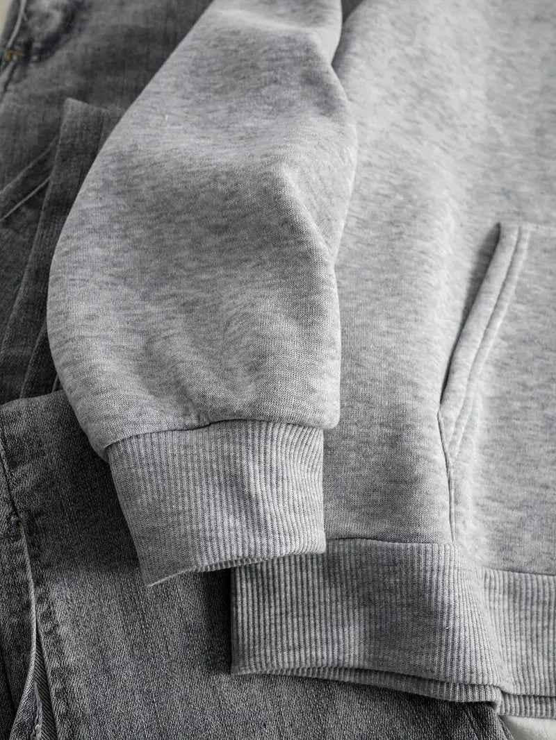 Close-up of the ribbed cuff and hem on the oversized women's hoodie.