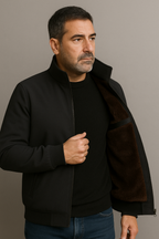 Men's fleece-lined zip jacket with a ribbed stand collar.