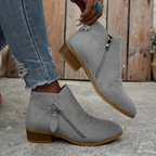 Women's block heel shoes in navy blue, featuring a zip closure and a modern, comfortable design. 1