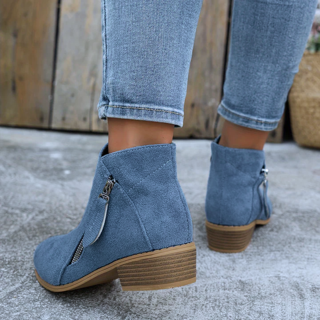 Women's block heel shoes in navy blue, featuring a zip closure and a modern, comfortable design. 6