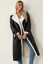 Kimberly longline coat in black, worn front view