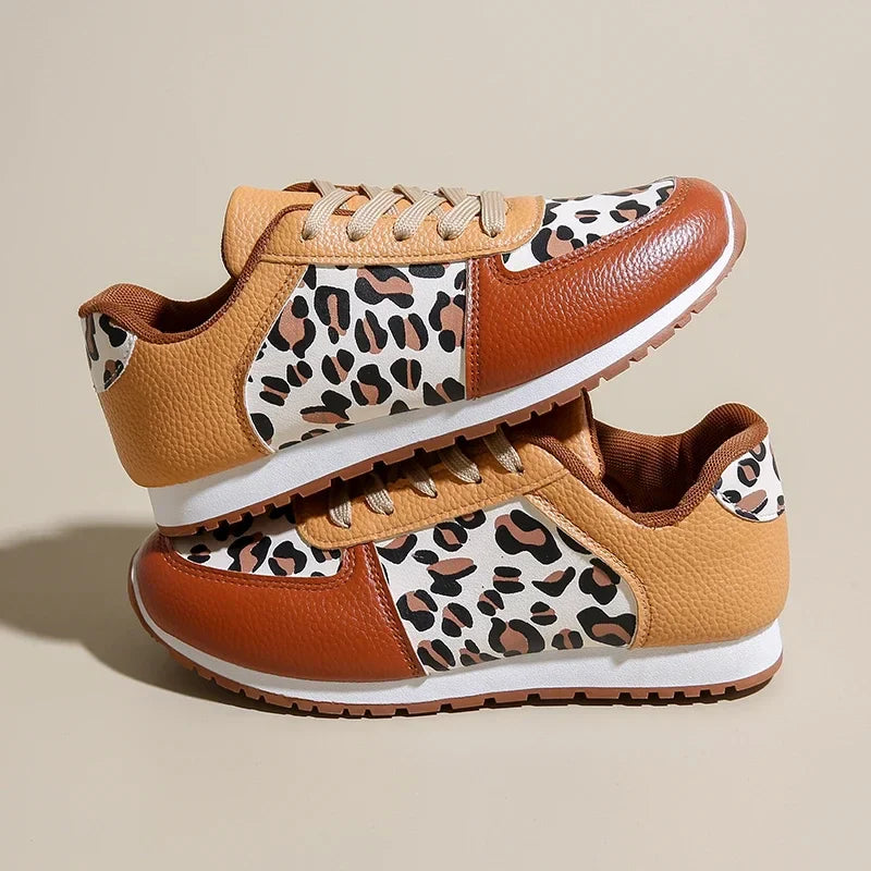Leopard print running shoes in brown and black, featuring a sporty design and lightweight construction. 0