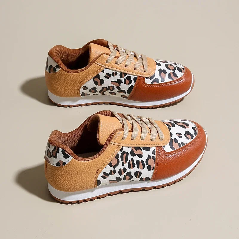 Leopard print running shoes in brown and black, featuring a sporty design and lightweight construction. 2