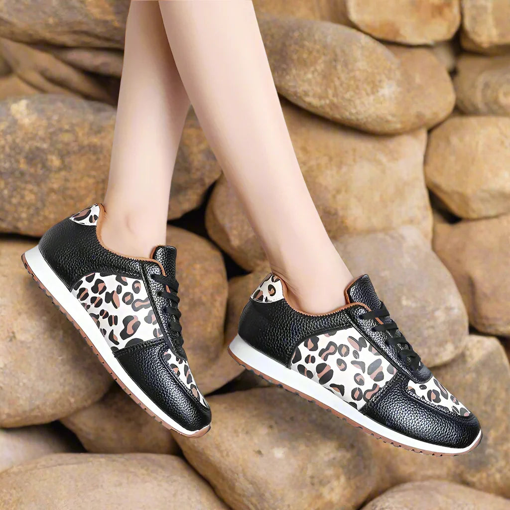 Leopard print running shoes in brown and black, featuring a sporty design and lightweight construction. 3