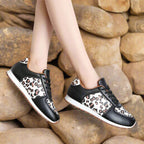 Leopard print running shoes in brown and black, featuring a sporty design and lightweight construction. 3