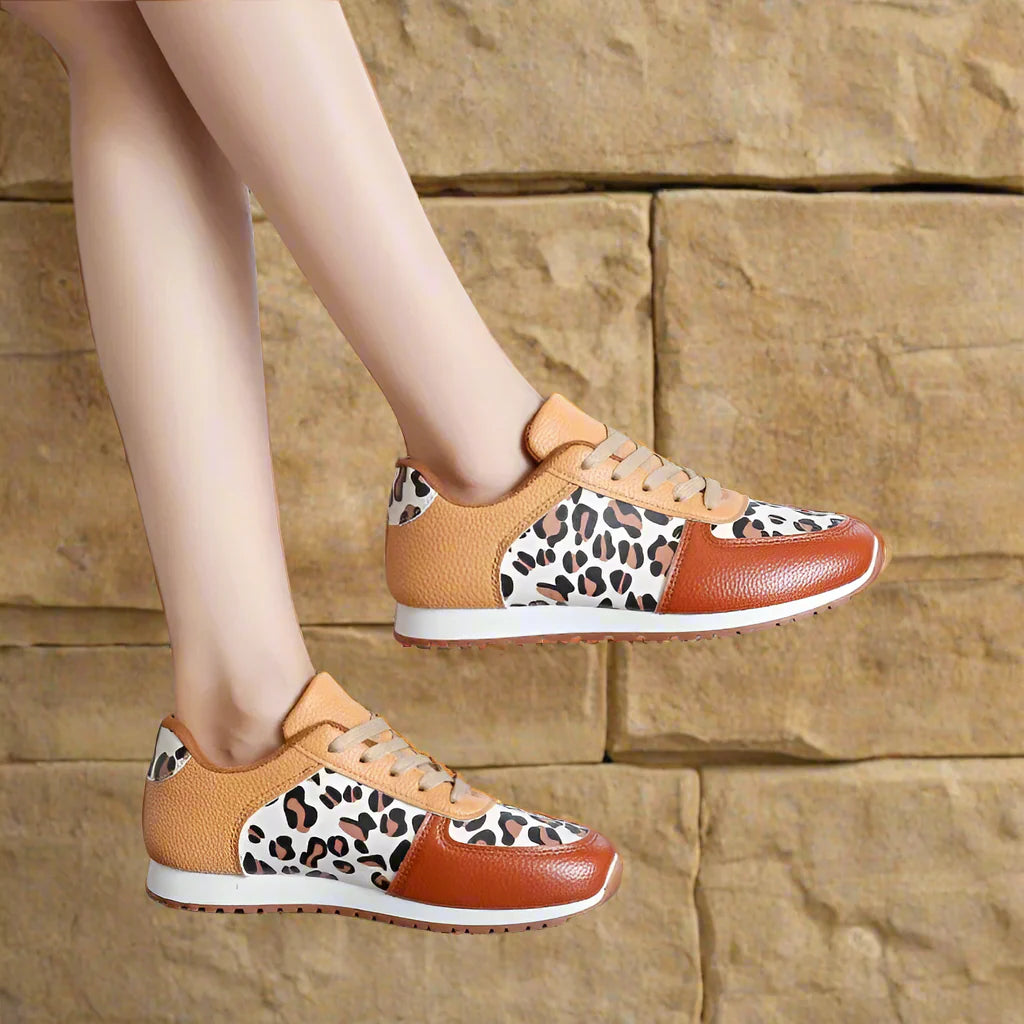 Leopard print running shoes in brown and black, featuring a sporty design and lightweight construction. 4