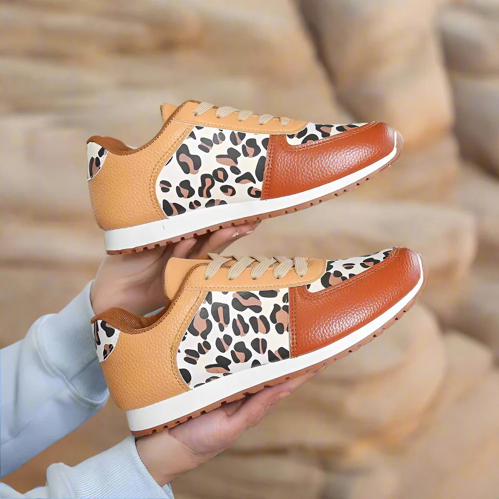 Leopard print running shoes in brown and black, featuring a sporty design and lightweight construction. 6