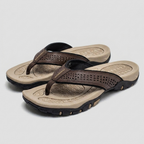 Men's flip flops in navy blue, featuring arch support and a sleek, water-resistant design. 2