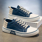 White minimalist sneakers with cushioned support, featuring a sleek design perfect for everyday wear. 1
