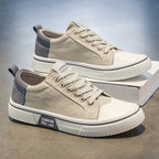 White minimalist sneakers with cushioned support, featuring a sleek design perfect for everyday wear. 6