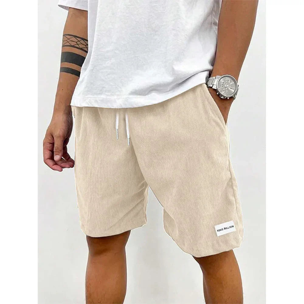 Men's relaxed-fit ribbed shorts in a soft grey color with an adjustable waistband. 0