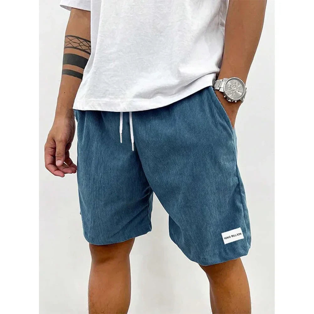 Men's relaxed-fit ribbed shorts in a soft grey color with an adjustable waistband. 5