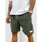 Men's relaxed-fit ribbed shorts in a soft grey color with an adjustable waistband. 6