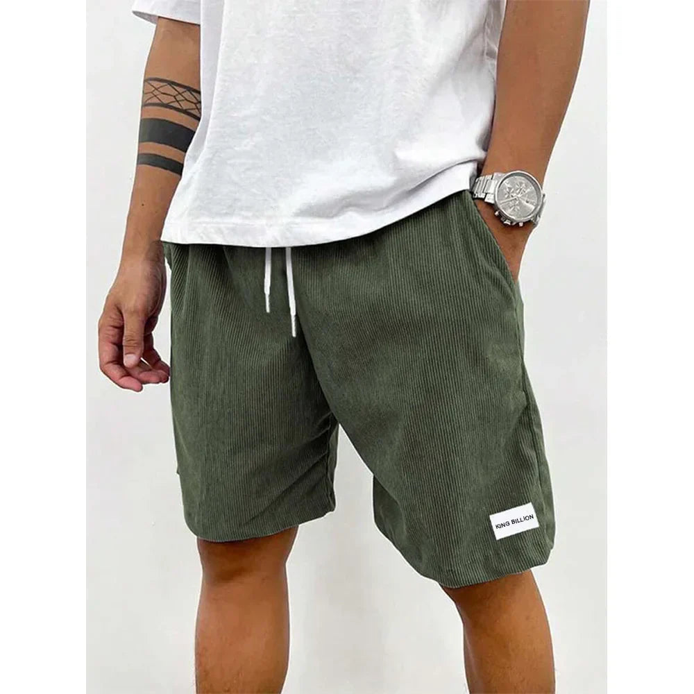 Men's relaxed-fit ribbed shorts in a soft grey color with an adjustable waistband. 6