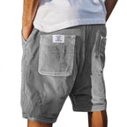 Men's tailored summer shorts in light beige with a textured finish, offering a smart-casual style. 0