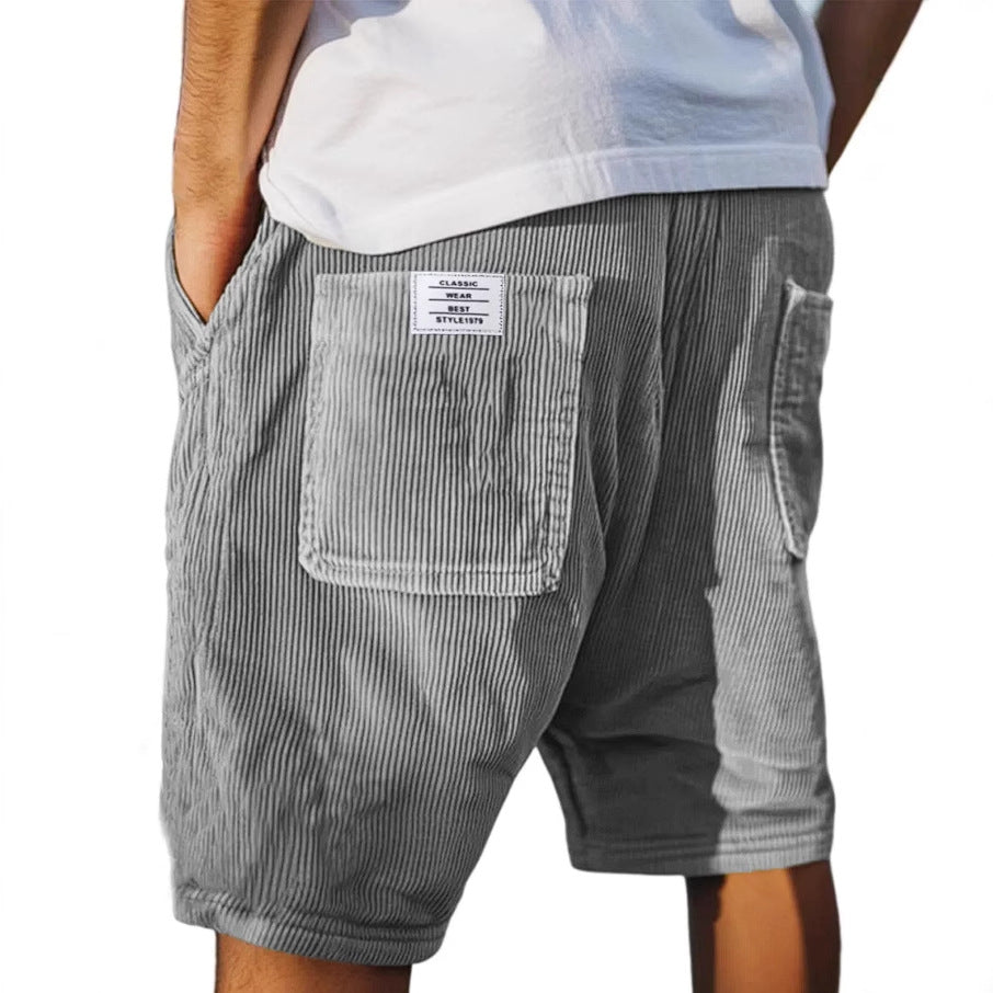 Men's tailored summer shorts in light beige with a textured finish, offering a smart-casual style. 0