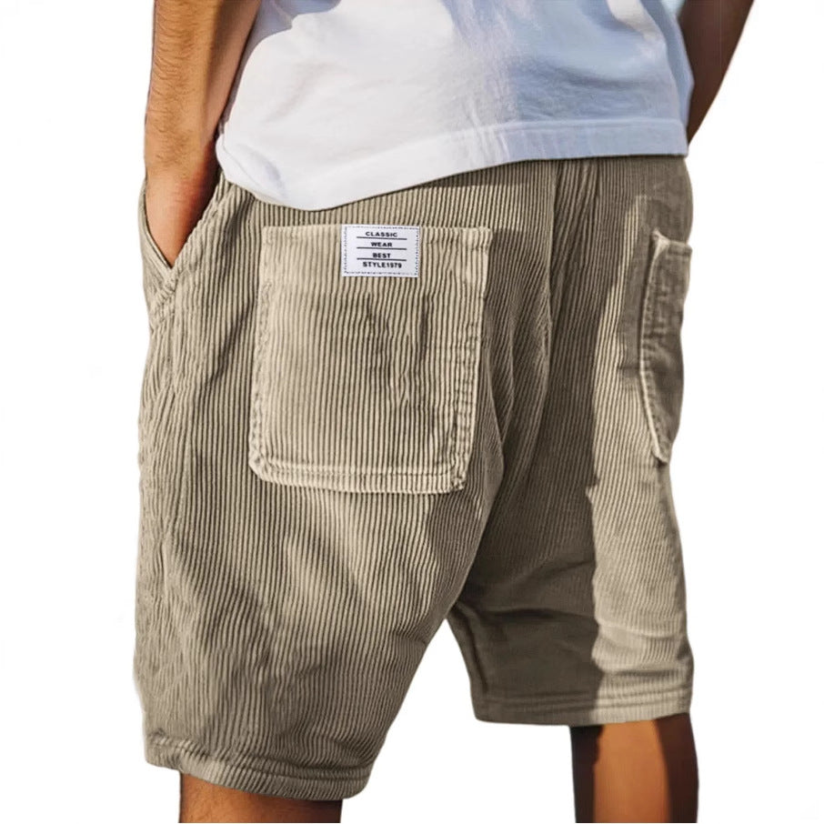 Men's tailored summer shorts in light beige with a textured finish, offering a smart-casual style. 1