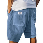 Men's tailored summer shorts in light beige with a textured finish, offering a smart-casual style. 2