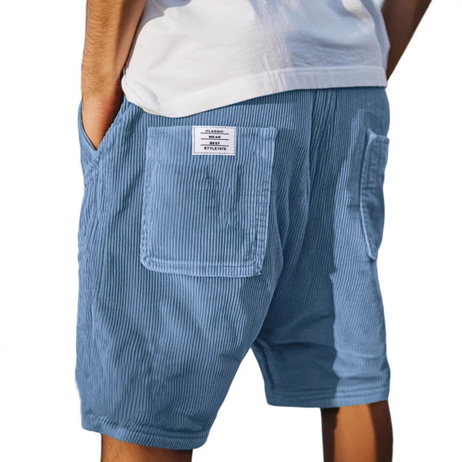 Men's tailored summer shorts in light beige with a textured finish, offering a smart-casual style. 2