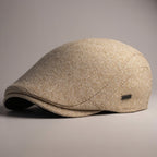 Soft blend wool beret in a muted gray color with a classic rounded silhouette. 1