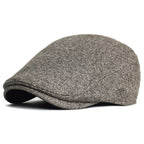 Soft blend wool beret in a muted gray color with a classic rounded silhouette. 2