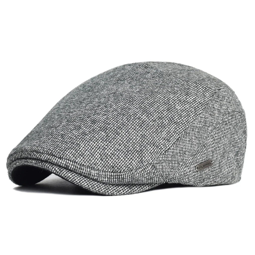Soft blend wool beret in a muted gray color with a classic rounded silhouette. 3