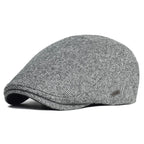Soft blend wool beret in a muted gray color with a classic rounded silhouette. 3