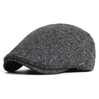 Soft blend wool beret in a muted gray color with a classic rounded silhouette. 5