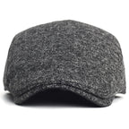 Soft blend wool beret in a muted gray color with a classic rounded silhouette. 6
