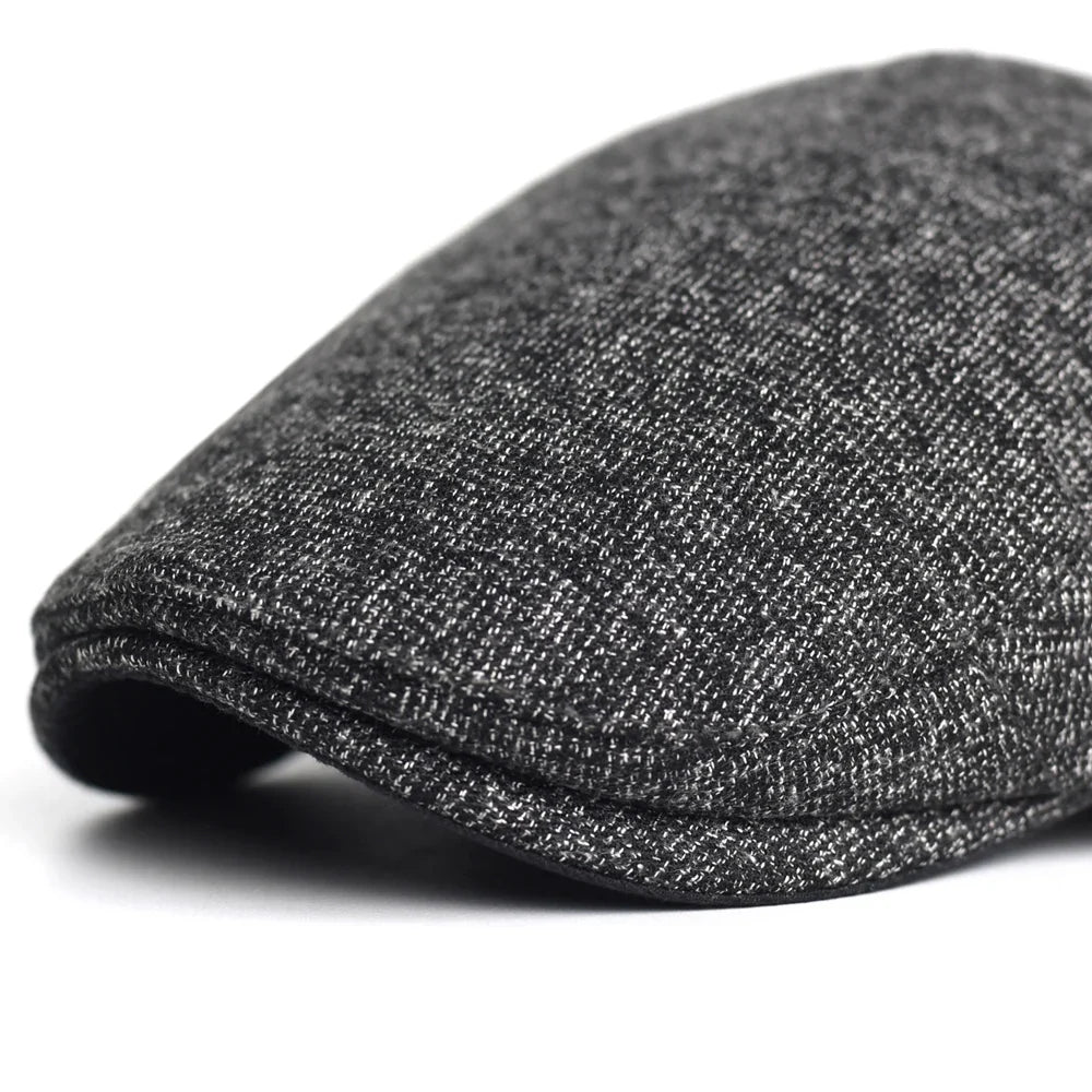 Soft blend wool beret in a muted gray color with a classic rounded silhouette. 7