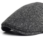 Soft blend wool beret in a muted gray color with a classic rounded silhouette. 7