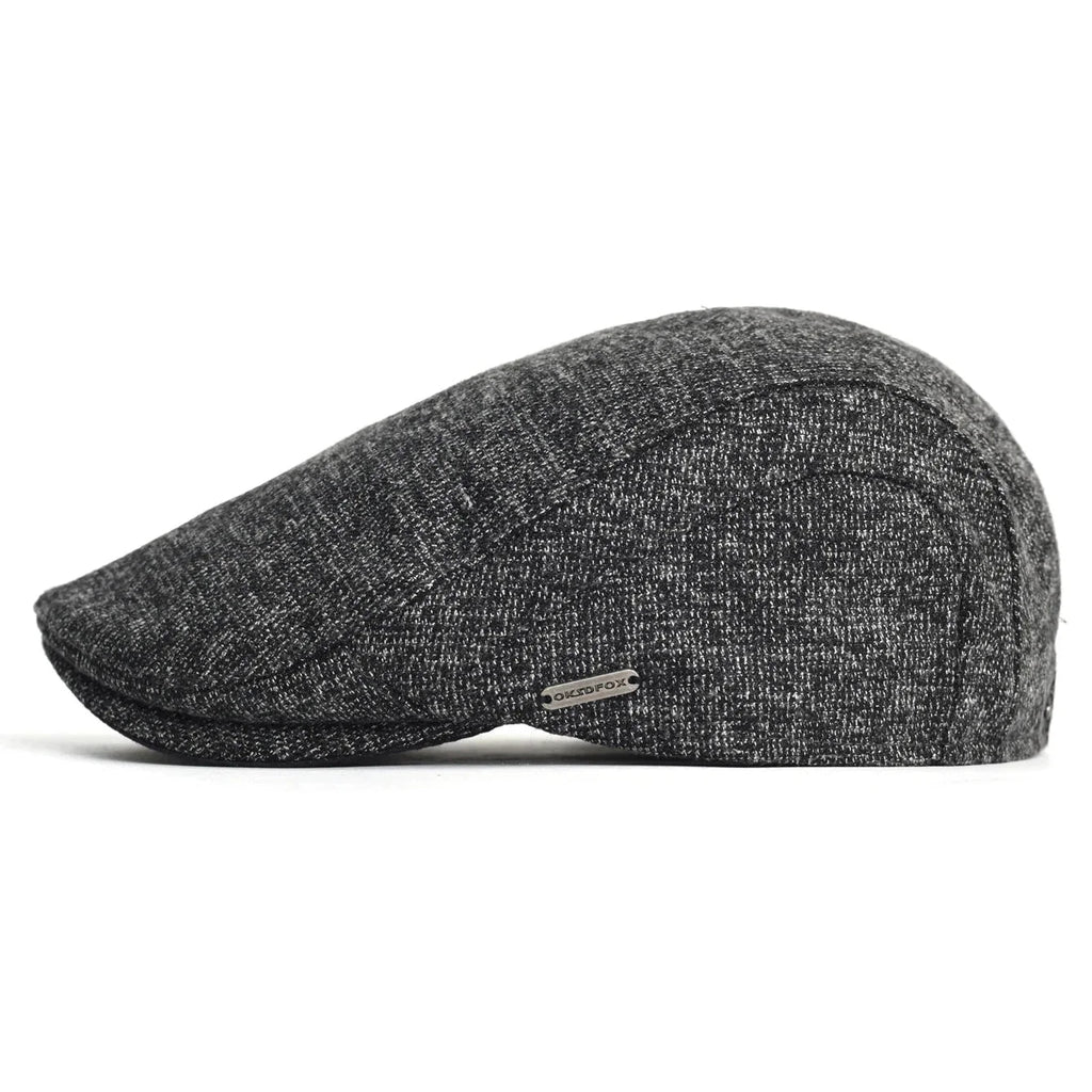Soft blend wool beret in a muted gray color with a classic rounded silhouette. 8
