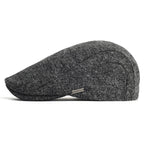 Soft blend wool beret in a muted gray color with a classic rounded silhouette. 8