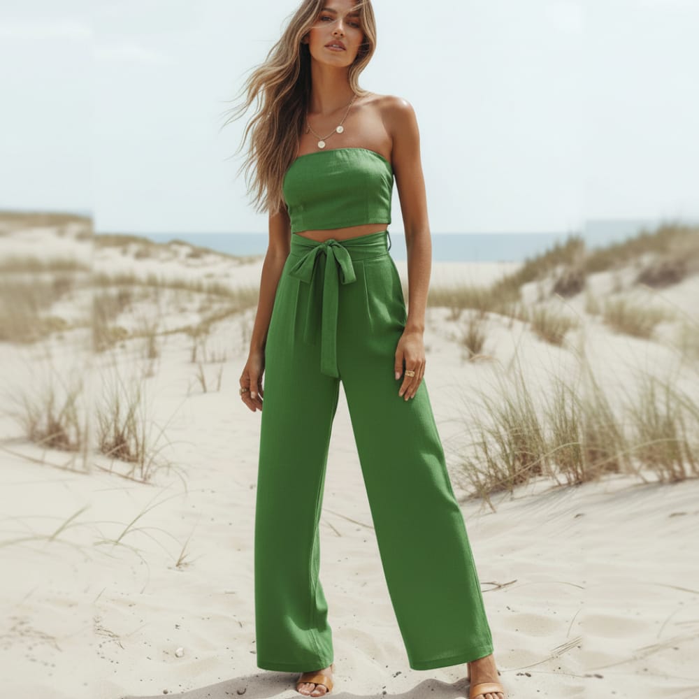 Backless bohemian jumpsuit in lilac with a bow tie waist, featuring a relaxed fit and flowing silhouette. 3
