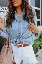Light blue chambray button-down shirt with roll-tab sleeves and pockets, featuring a casual and relaxed style. 7