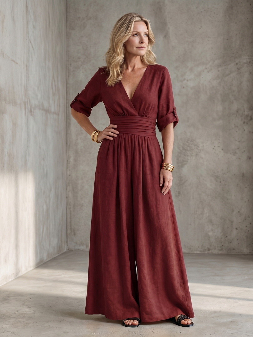 Lila wide leg jumpsuit in deep violet with a cross front and elbow-length sleeves, featuring a chic and elegant style. 7