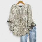 Lila floral blouse, light purple with ruffled sleeves, in a relaxed fit for women. 7
