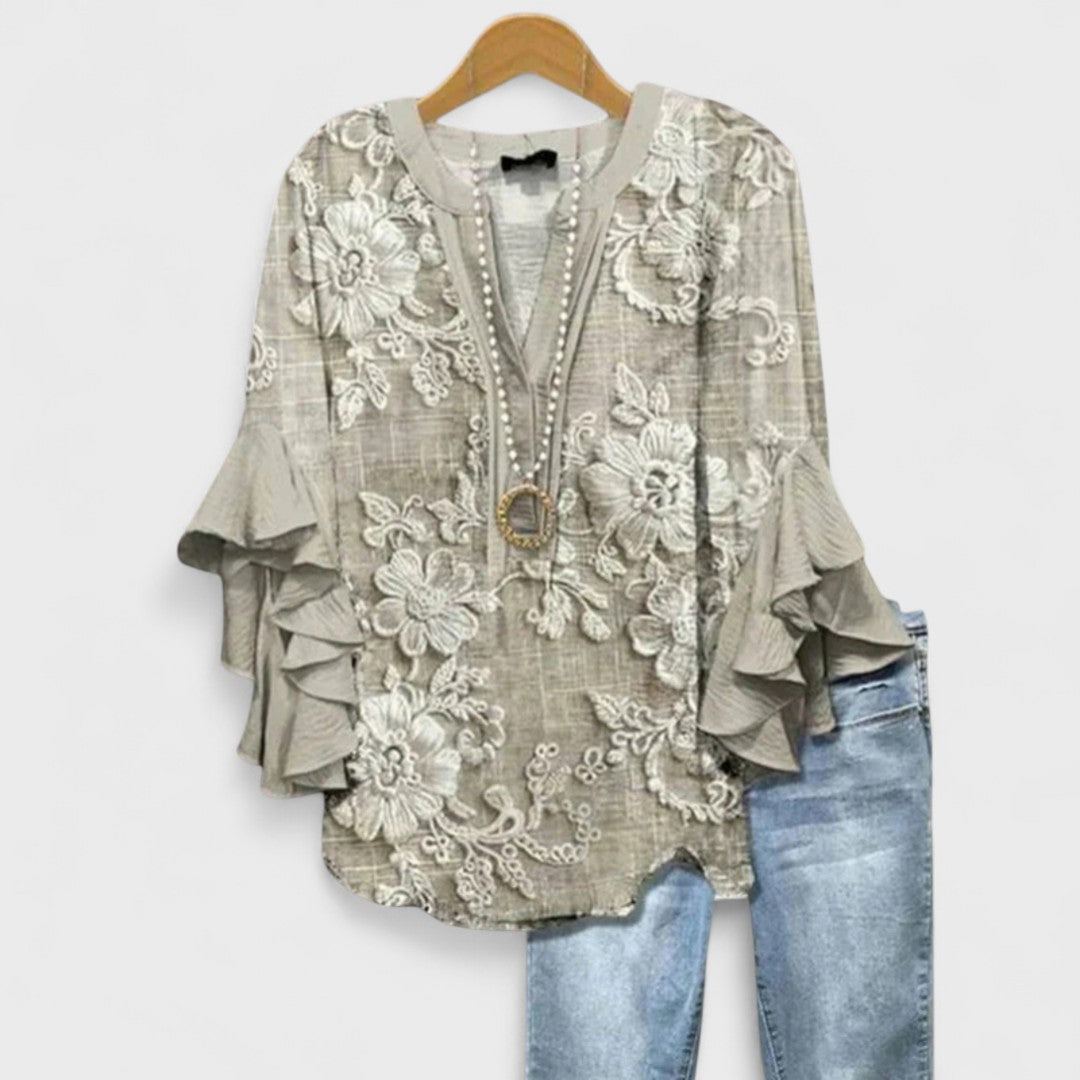 Lila floral blouse, light purple with ruffled sleeves, in a relaxed fit for women. 7