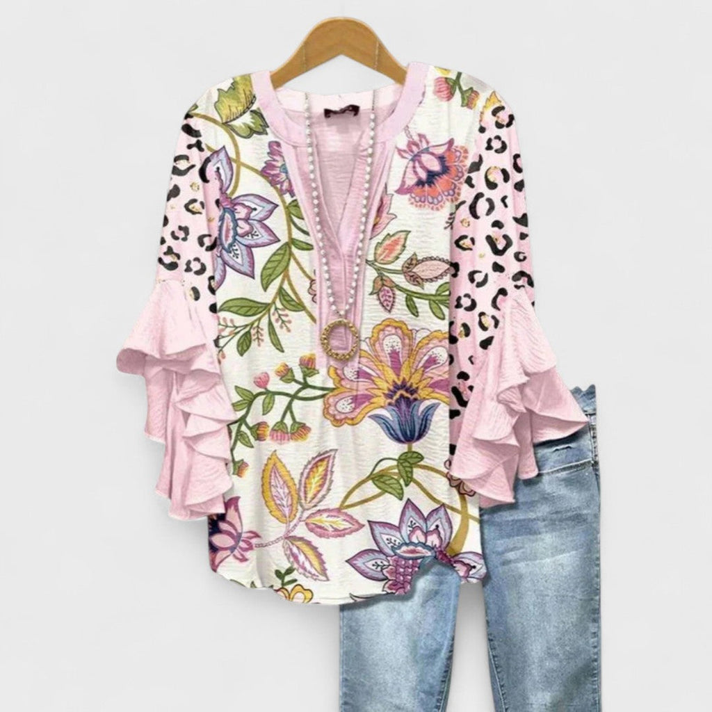 Lila floral blouse, light purple with ruffled sleeves, in a relaxed fit for women. 8