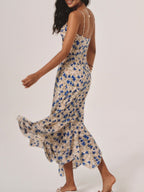 Lila floral maxi dress in soft purple with an irregular hem, featuring a flowing, bohemian style. 1