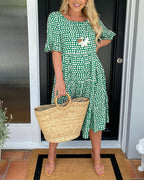 Lila A-line dress in soft lavender with white polka dots and ruffle sleeves. 1