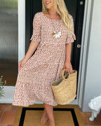 Lila A-line dress in soft lavender with white polka dots and ruffle sleeves. 8